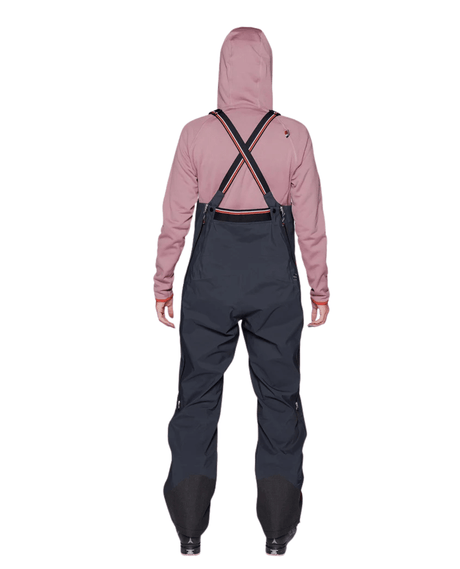 Elevenate Womens Pure Bib Pants - Dark Ink bakifrån som visar hängslen och passform - Skidbyxor - Alpingaraget