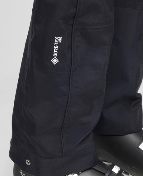 Mammut Eiger Free Pro HS Bib Pants Women i svart med Gore-Tex Pro-detalj på benet - Alpingaraget