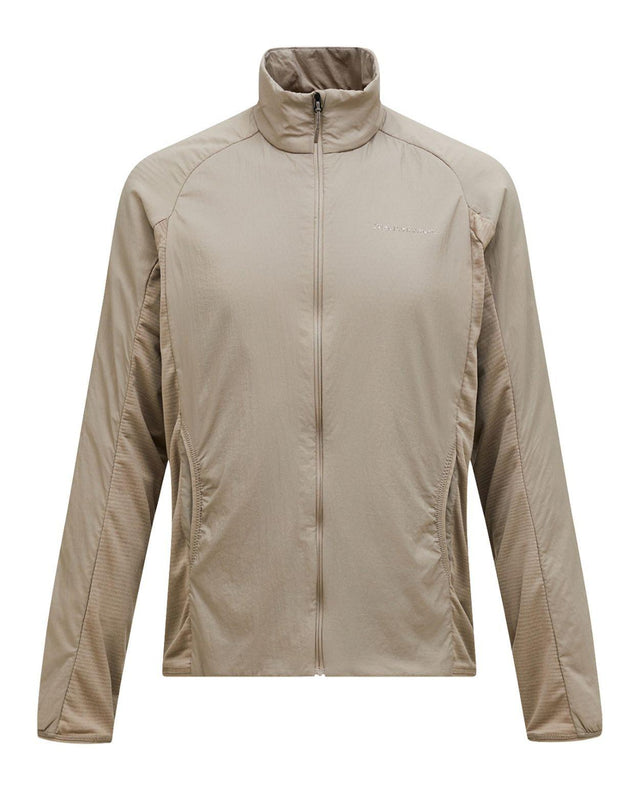Peak Performance Freelight Hybrid Liner Men - Avid Beige, en beige hybridjacka för herrar anpassad för skidåkning och friluftsliv.