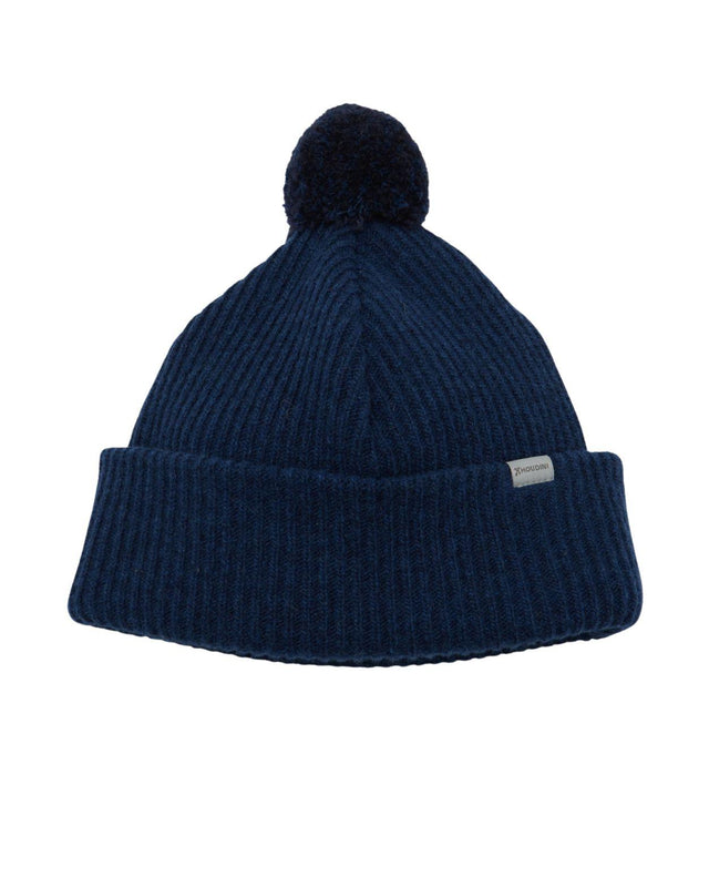 Blå ribbad mössa med pompom och uppvikt kant från Houdini i färgen Hombre Blue.