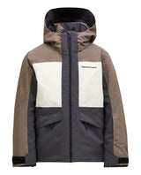 Peak Performance Gravity Insulated Jacket Junior i färgerna terrain tan och sand fog för skidåkning.