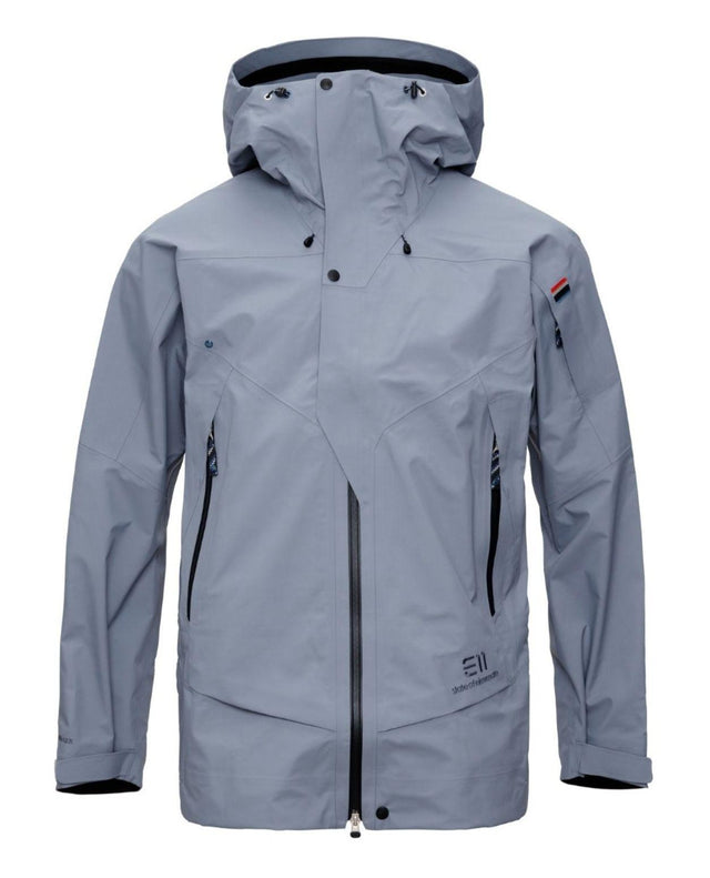 Elevenate Pure Jacket Men i färgen Blue Flint, en funktionell skidjacka för herr med huva.