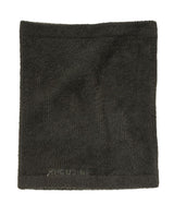 Houdini Lykan Neck Gaiter i grön illusion, en mjuk tubhalsduk med diskret logotyp.