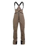 Peak Performance Stretch Bib Pants dam i färgerna terrain tan och svart.