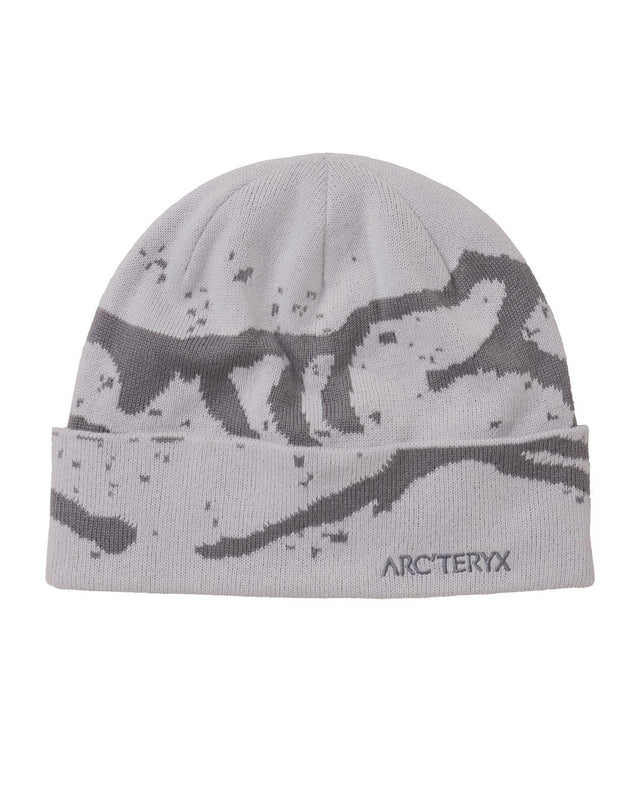 Arc'teryx Grotto Toque i grått med bergsmotiv och uppvikbar kant för kalla dagar på berget.