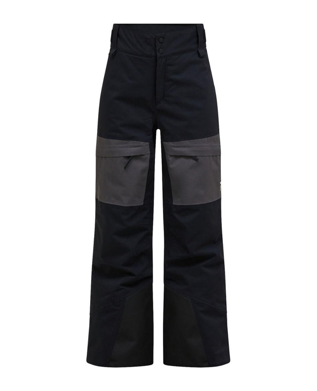 Peak Performance Gravity Insulated Pants Junior i svart och grått, ett par varma och slitstarka skidbyxor för unga skidåkare.