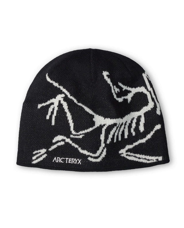 Arc'teryx Bird Head Toque - Svart mössa med stickad fågelgrafik i vitt för sköna dagar på berget.