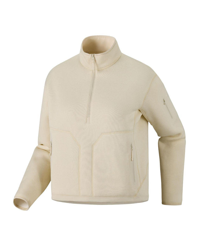 Arc'teryx Covert 1/2 Zip dammellanlager i beige fleece med återvunnet material och hög krage.