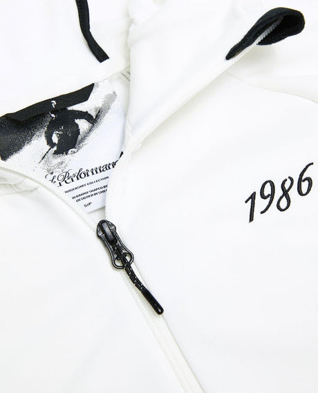 Peak Performance 40Y Rider Zip Hood dam i offwhite, närbild på dragkedja, detaljer och tryck.