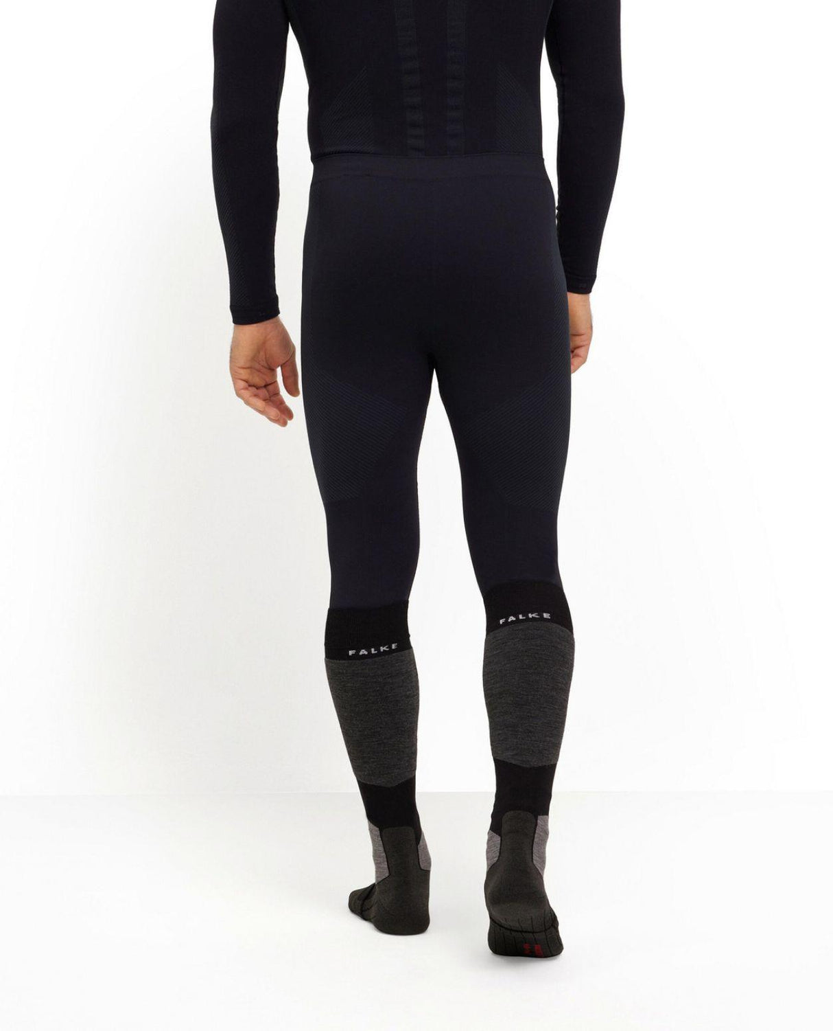 Falke Warm Long Tights för dam i svart färg som visar baksidan av underställsbyxorna.