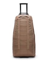 D_b_ Hugger Roller Bag 90L i färg Affogato Brown, en robust resväska för skidresan.