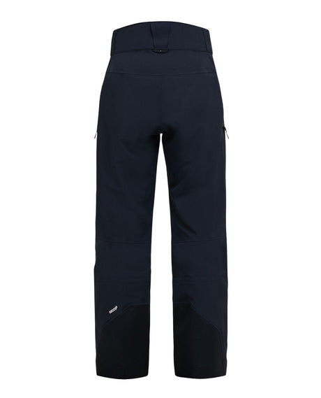 Peak Performance 40Y R&D Gore-Tex skidbyxor för herr i svart, sedda bakifrån.