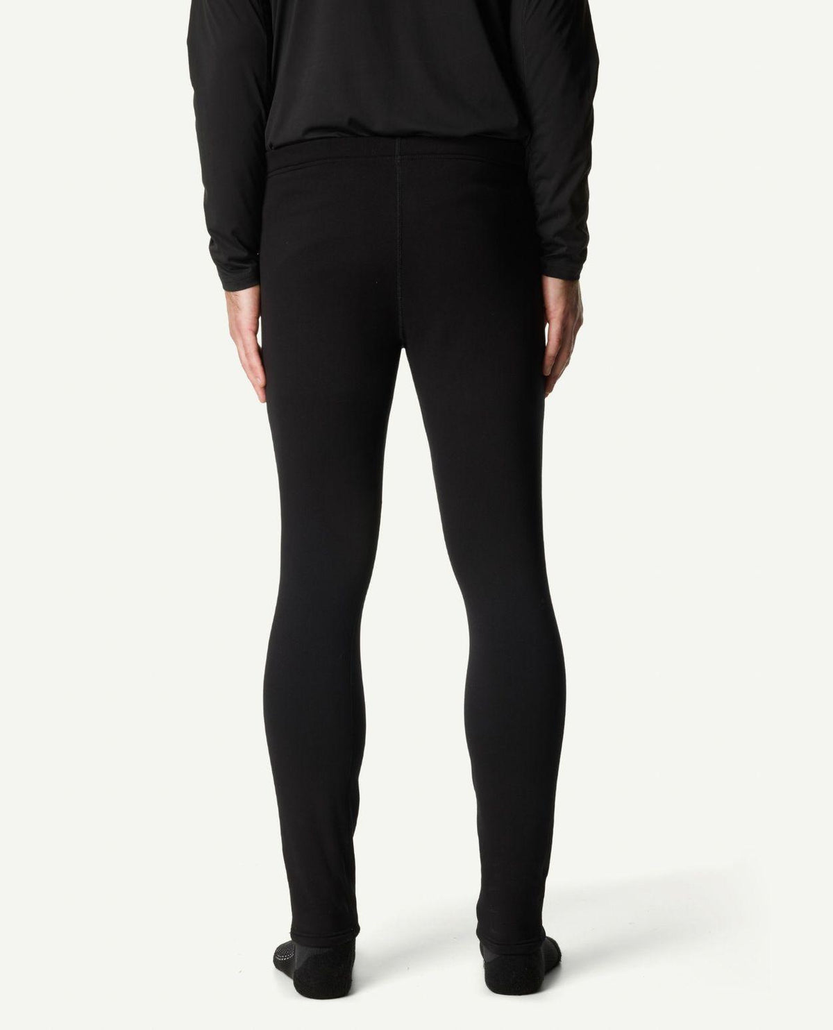 Baksidesvy av svarta underställsbyxor för herrar från Houdini på modell.