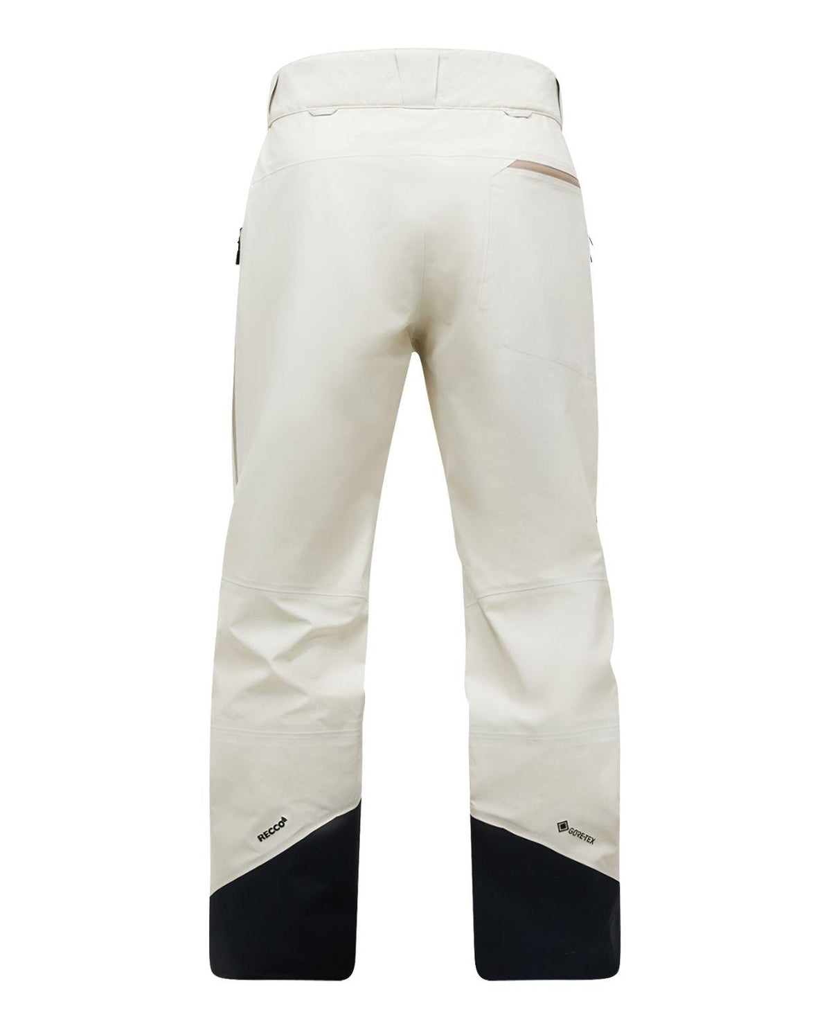 Peak Performance Alpine Gore-Tex 3L Pants Women i färgen Sand Fog visas bakifrån. Slitstarka dam skidbyxor med förstärkta svarta benslut och Recco-reflektorer.